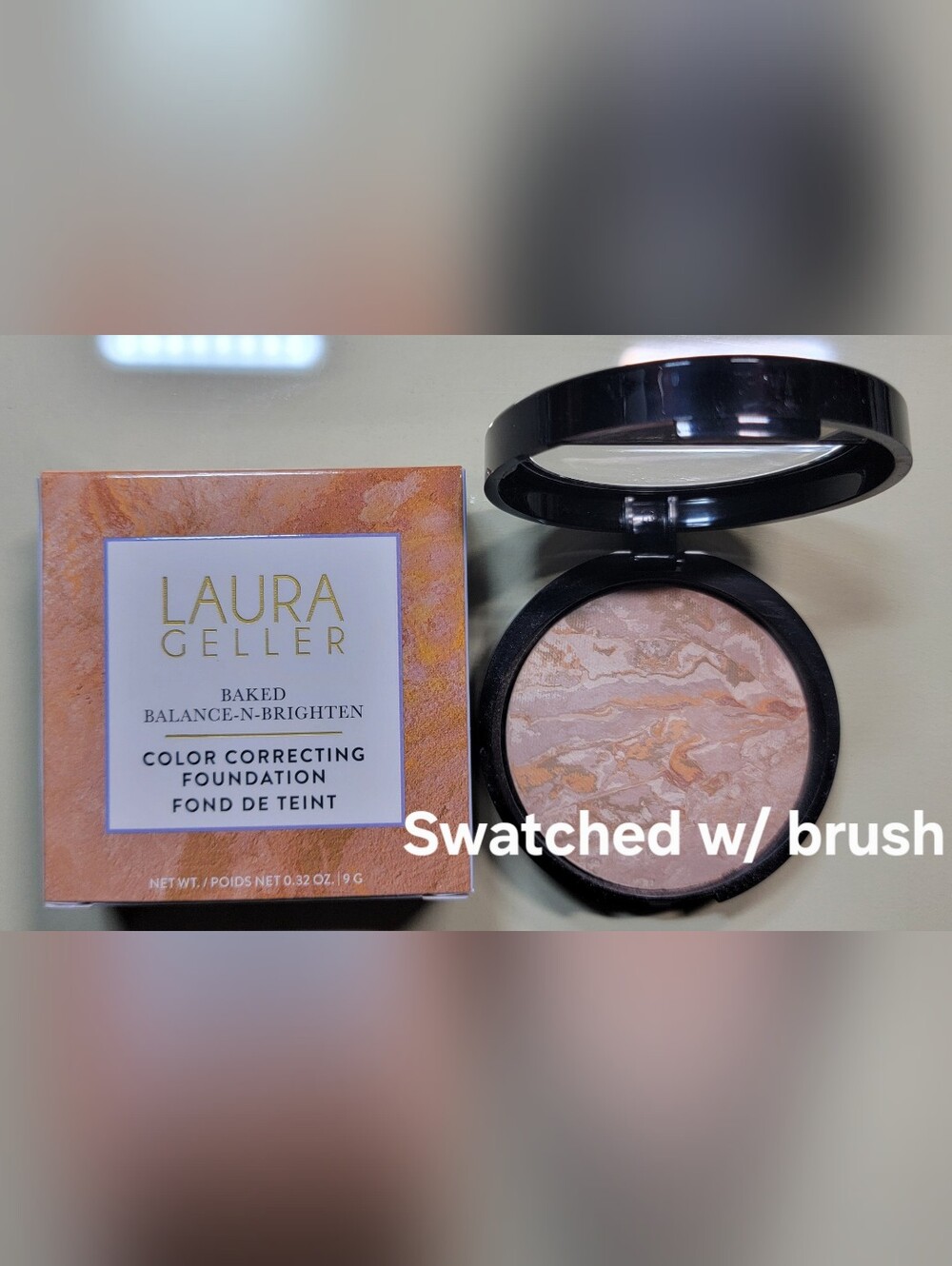 Laura Geller Baked Brightening Powder in Peach Marble